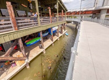 kids feeding ducks along Waco Riverwalk trail